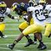 Tight end Devin Funchess is tackled during the Michigan spring football game on Saturday, April 13. AnnArbor.com I Daniel Brenner